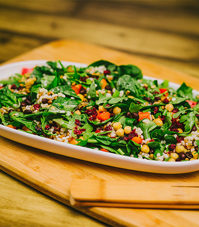 Ultimate Can'Eh'Dian Salad on a wood cutting board