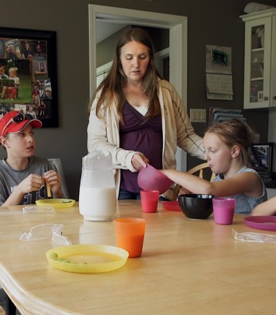 Mother and children at breakfast table