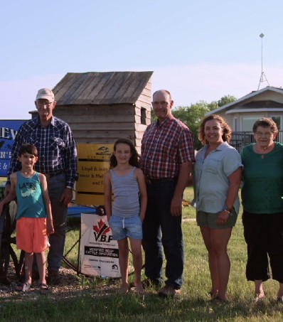 Farmer family poses for a picture