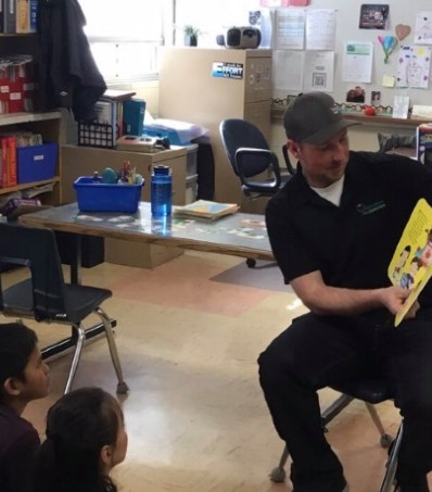 Farmer reads book in classroom