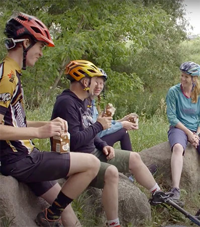 Mountain Biking Family Drinking Milk