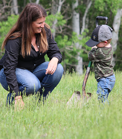 Farmer and child with shovel