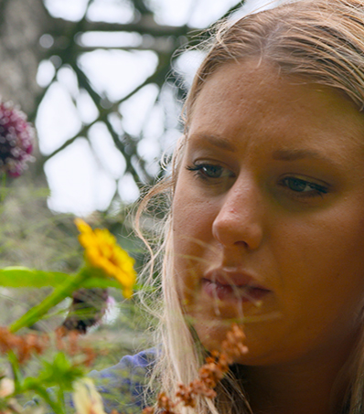 Woman looking at Flowers