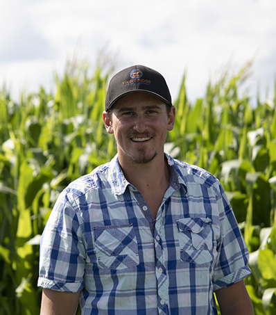 Farmer in front of a corn field