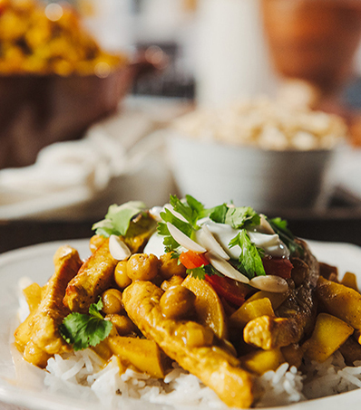 Stew of pork and apples served over rice